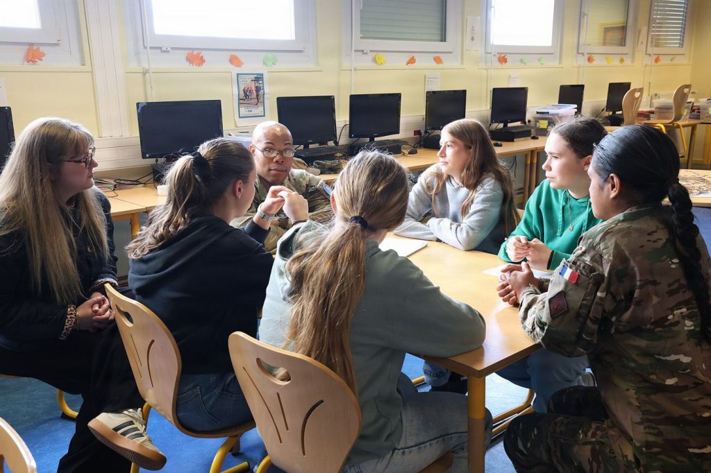 students asking questions during a classroom lesson