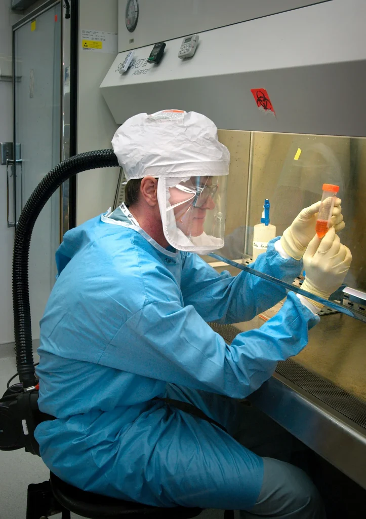 Inside the $112 Million Contract Disruption Slowing US Disease Tracking Researcher carrying out influenza virus research in a laboratory