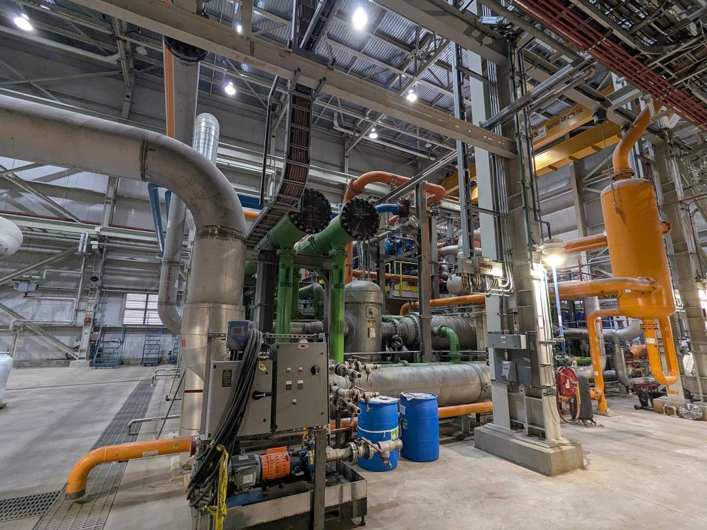 Carbon Capture Projects Are Scaling Up — and the Early Results Are Mixed but Real Industrial carbon capture plant with tall capture towers and pipework under a clear sky